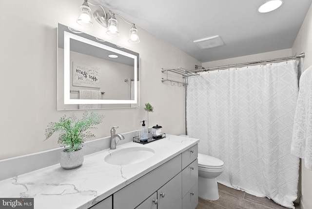 803 N Howard St Unit 435, Alexandria, VA 22304 - bathroom featuring vanity, toilet, wood finished floors, and a shower with shower curtain