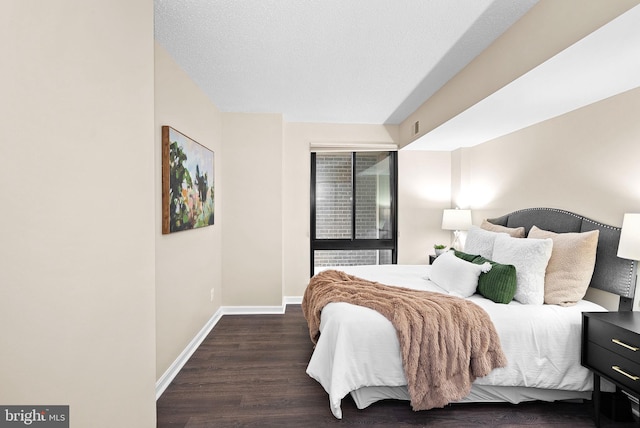 803 N Howard St Unit 435, Alexandria, VA 22304 - bedroom with baseboards and wood finished floors