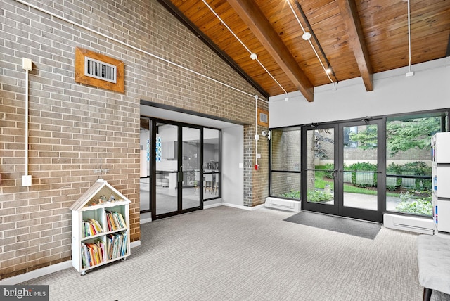 803 N Howard St Unit 435, Alexandria, VA 22304 - lobby with wood ceiling with exposed beams, high vaulted ceiling, and brick wall