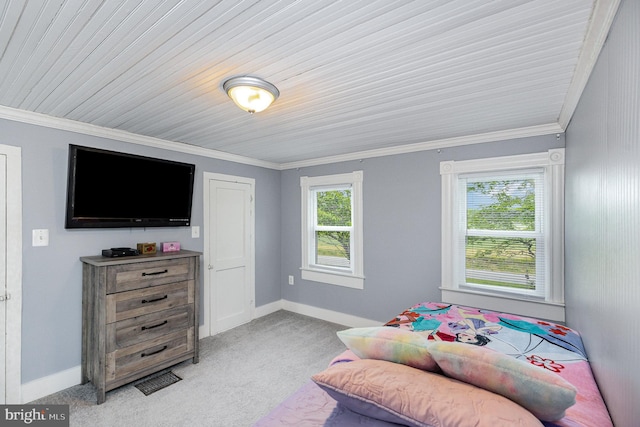 bedroom featuring light colored carpet, ornamental molding, and baseboards
