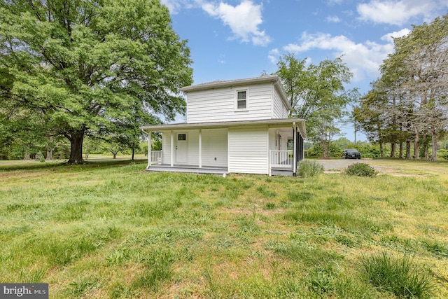 back of property featuring a porch