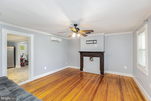 unfurnished living room with crown molding, a wall mounted air conditioner, baseboards, and ceiling fan