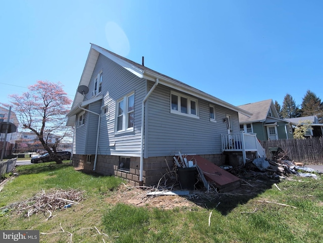 rear view of property with fence