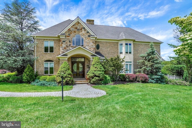 2800 Deer Leap Ln, York, PA 17403 - view of front of house with a chimney, a front lawn, french doors, and brick siding