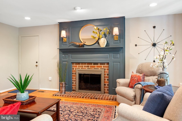 7185 Rivers Edge Rd, Columbia, MD 21044 - living room with baseboards, a brick fireplace, wood finished floors, and recessed lighting