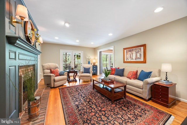 7185 Rivers Edge Rd, Columbia, MD 21044 - living room with a fireplace, wood finished floors, baseboards, and recessed lighting