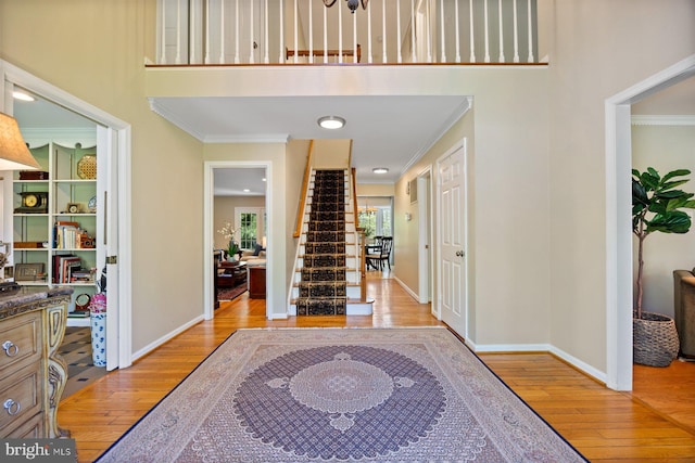 7185 Rivers Edge Rd, Columbia, MD 21044 - entrance foyer featuring light wood finished floors, baseboards, and ornamental molding