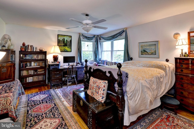 bedroom with wood finished floors and a ceiling fan