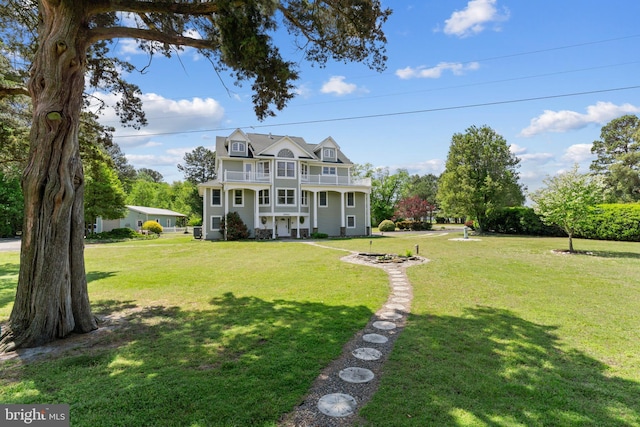 30602 Sandy Landing Rd, Dagsboro, DE 19939 - view of front of property with a front yard and a balcony