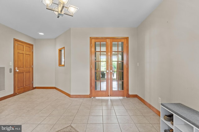 30602 Sandy Landing Rd, Dagsboro, DE 19939 - entryway featuring baseboards, light tile patterned flooring, french doors, and an inviting chandelier