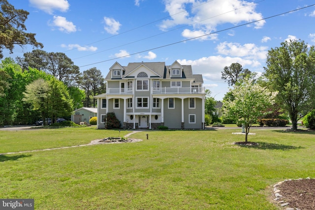 30602 Sandy Landing Rd, Dagsboro, DE 19939 - view of front of house with covered porch, a balcony, and a front lawn