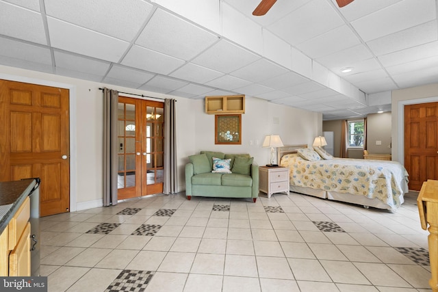 30602 Sandy Landing Rd, Dagsboro, DE 19939 - bedroom with french doors, baseboards, a drop ceiling, and light tile patterned flooring