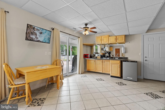 30602 Sandy Landing Rd, Dagsboro, DE 19939 - kitchen with dark countertops, ceiling fan, a drop ceiling, and light tile patterned flooring