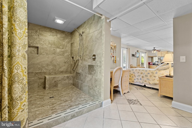 30602 Sandy Landing Rd, Dagsboro, DE 19939 - ensuite bathroom with a paneled ceiling, tile patterned flooring, baseboards, ensuite bathroom, and tiled shower