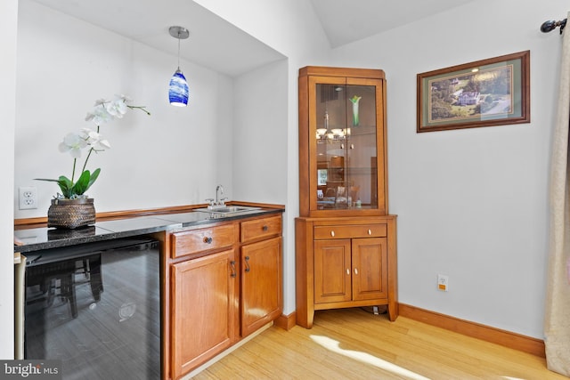 30602 Sandy Landing Rd, Dagsboro, DE 19939 - bar with a sink, light wood finished floors, baseboards, decorative light fixtures, and wine cooler