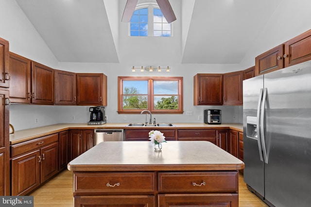 30602 Sandy Landing Rd, Dagsboro, DE 19939 - kitchen with light countertops, appliances with stainless steel finishes, a sink, and light wood-style flooring