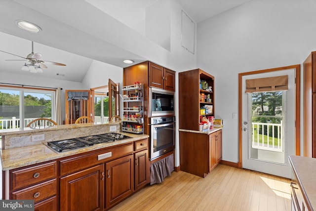 30602 Sandy Landing Rd, Dagsboro, DE 19939 - kitchen with visible vents, a peninsula, ceiling fan, light wood-style flooring, and appliances with stainless steel finishes