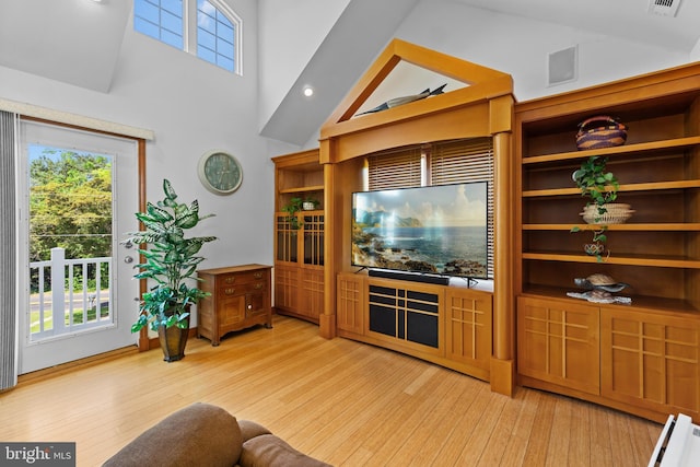 30602 Sandy Landing Rd, Dagsboro, DE 19939 - living room featuring a high ceiling and light wood-style floors