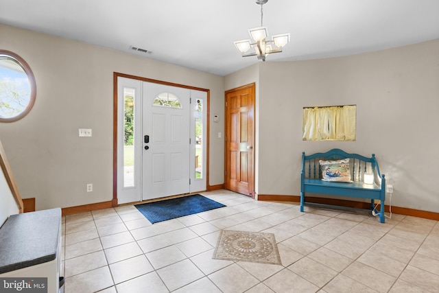 30602 Sandy Landing Rd, Dagsboro, DE 19939 - foyer entrance with light tile patterned floors, baseboards, a chandelier, and visible vents