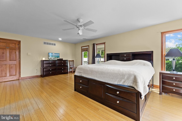 30602 Sandy Landing Rd, Dagsboro, DE 19939 - bedroom with visible vents, light wood-style flooring, ceiling fan, and baseboards
