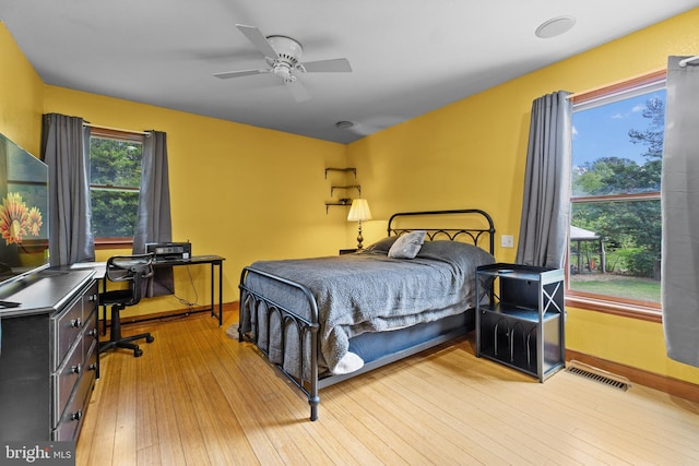 30602 Sandy Landing Rd, Dagsboro, DE 19939 - bedroom featuring visible vents, baseboards, ceiling fan, and hardwood / wood-style floors
