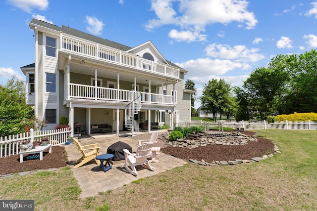 30602 Sandy Landing Rd, Dagsboro, DE 19939 - rear view of house featuring a balcony, a patio, a fenced backyard, stairs, and a yard