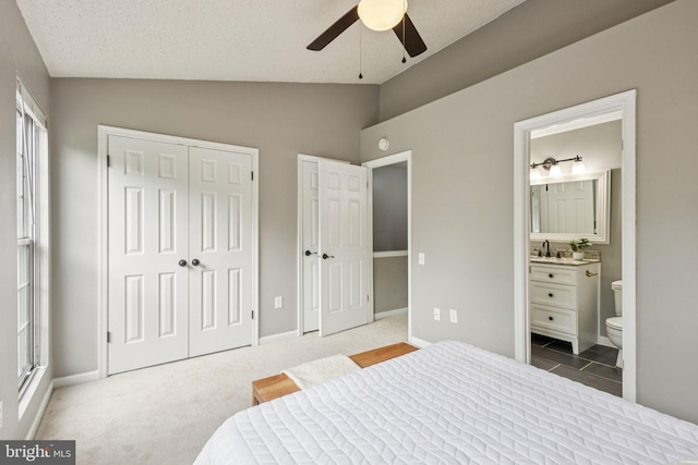 3723 Hampton Ct, Alexandria, VA 22306 - bedroom with lofted ceiling, ensuite bath, a textured ceiling, and a ceiling fan