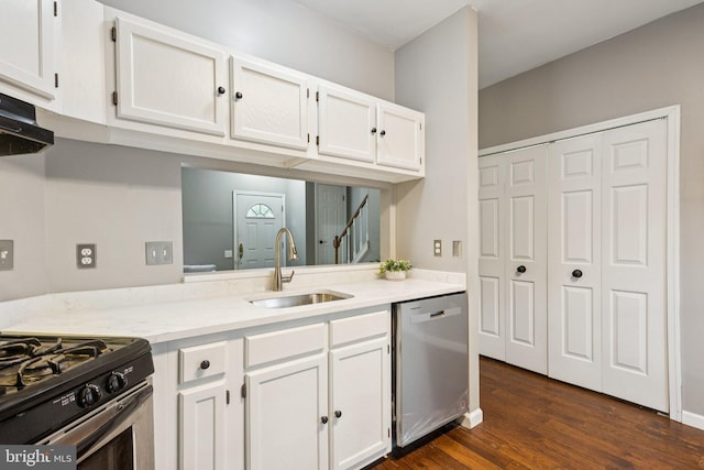 3723 Hampton Ct, Alexandria, VA 22306 - kitchen featuring dishwasher, white cabinetry, dark wood-type flooring, extractor fan, and light stone counters