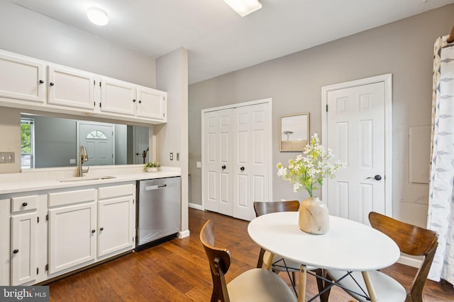 3723 Hampton Ct, Alexandria, VA 22306 - kitchen with stainless steel dishwasher, white cabinetry, light countertops, and dark wood finished floors