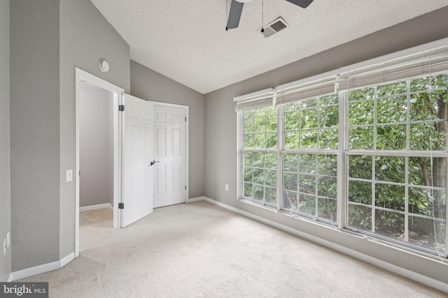 3723 Hampton Ct, Alexandria, VA 22306 - unfurnished bedroom featuring carpet flooring, vaulted ceiling, a textured ceiling, and ceiling fan