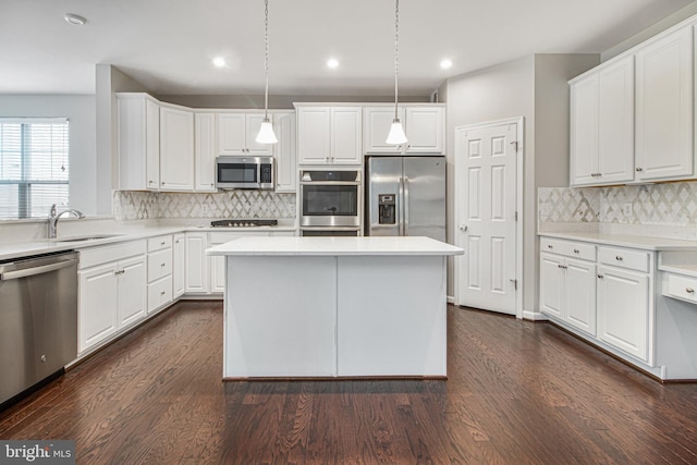 15916 Aerial View Rd, Woodbridge, VA 22193 - kitchen featuring appliances with stainless steel finishes, a sink, white cabinetry, and recessed lighting