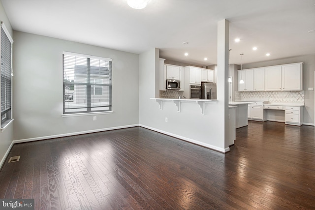15916 Aerial View Rd, Woodbridge, VA 22193 - unfurnished living room with dark wood finished floors, baseboards, and recessed lighting