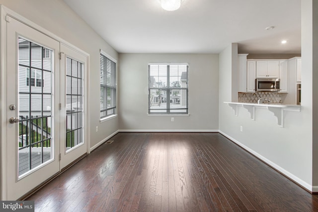 15916 Aerial View Rd, Woodbridge, VA 22193 - unfurnished dining area with dark wood finished floors, baseboards, and recessed lighting