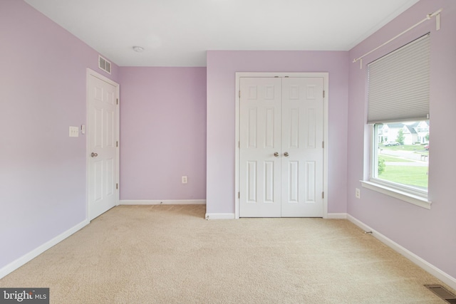15916 Aerial View Rd, Woodbridge, VA 22193 - unfurnished bedroom featuring light carpet, a closet, and baseboards