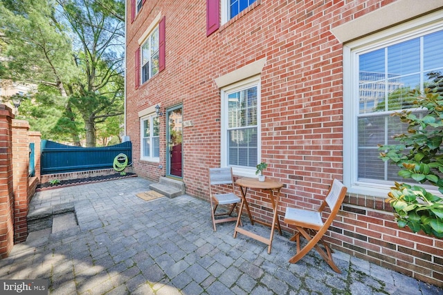 view of patio / terrace featuring fence and entry steps