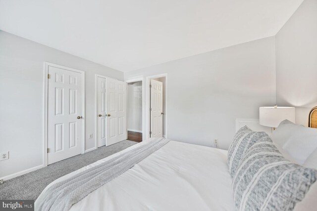 bedroom featuring carpet flooring and baseboards