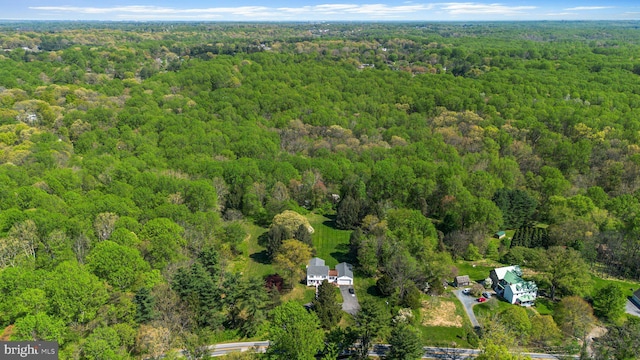 bird's eye view featuring a wooded view