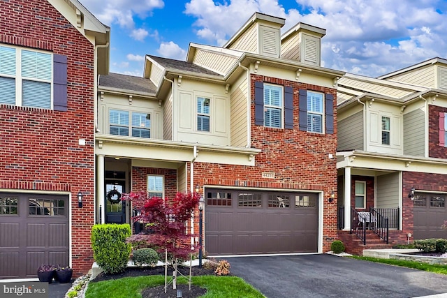 44251 Silverpalm Grove Ter, Leesburg, VA 20176 - multi unit property featuring brick siding, an attached garage, and driveway