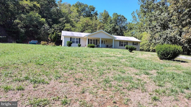 ranch-style home with a front lawn