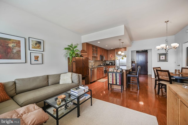 12500 Park Potomac Ave Unit 905South, Potomac, MD 20854 - living area with dark wood-style flooring and a chandelier