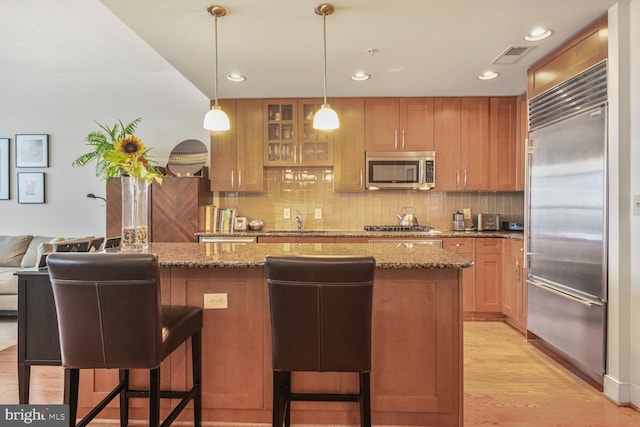 12500 Park Potomac Ave Unit 905South, Potomac, MD 20854 - kitchen featuring appliances with stainless steel finishes, a sink, decorative backsplash, stone countertops, and recessed lighting