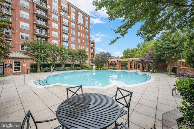 12500 Park Potomac Ave Unit 905South, Potomac, MD 20854 - community pool with a patio area and a pergola