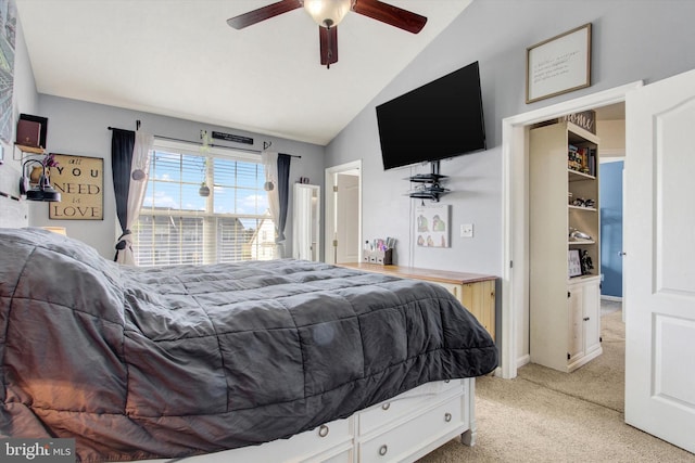 bedroom with vaulted ceiling, a ceiling fan, and light carpet