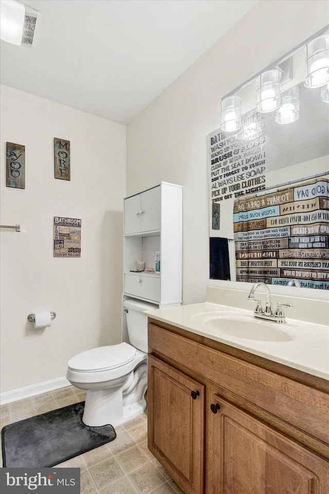 full bathroom with tile patterned floors, visible vents, toilet, vanity, and baseboards