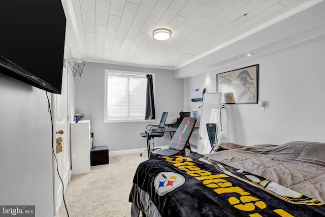 carpeted bedroom featuring baseboards and ornamental molding