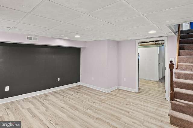 1060 Elm Rd, Baltimore, MD 21227 - finished basement with stairway, baseboards, wood finished floors, recessed lighting, and a paneled ceiling
