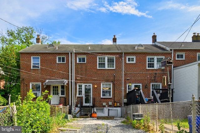 1060 Elm Rd, Baltimore, MD 21227 - back of property with brick siding and a chimney
