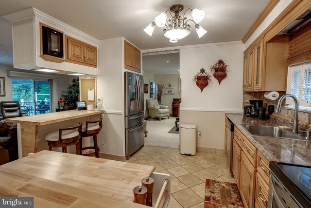 2066 Old York Rd, Burlington, NJ 08016 - kitchen featuring stainless steel appliances, a sink, a chandelier, light tile patterned flooring, and baseboards