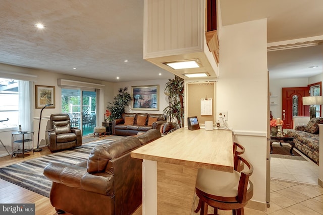 2066 Old York Rd, Burlington, NJ 08016 - kitchen with open floor plan, a breakfast bar area, recessed lighting, a peninsula, and light tile patterned floors