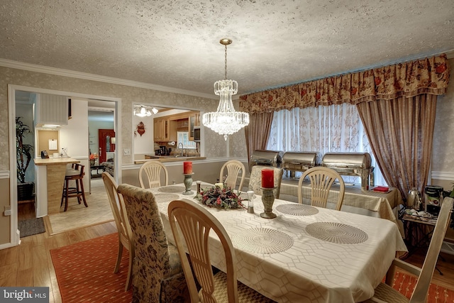 2066 Old York Rd, Burlington, NJ 08016 - dining room with a chandelier, light wood-style floors, ornamental molding, and a textured ceiling